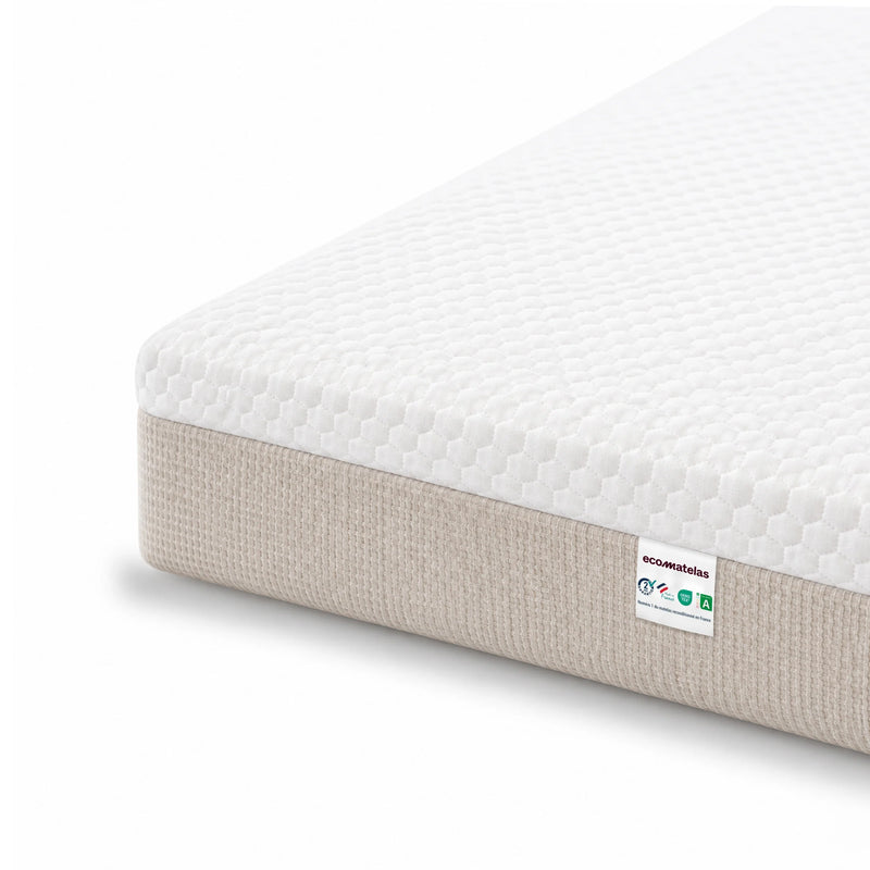 Zoom sur la housse blanche et le tissu beige du matelas Idéal 20 cm