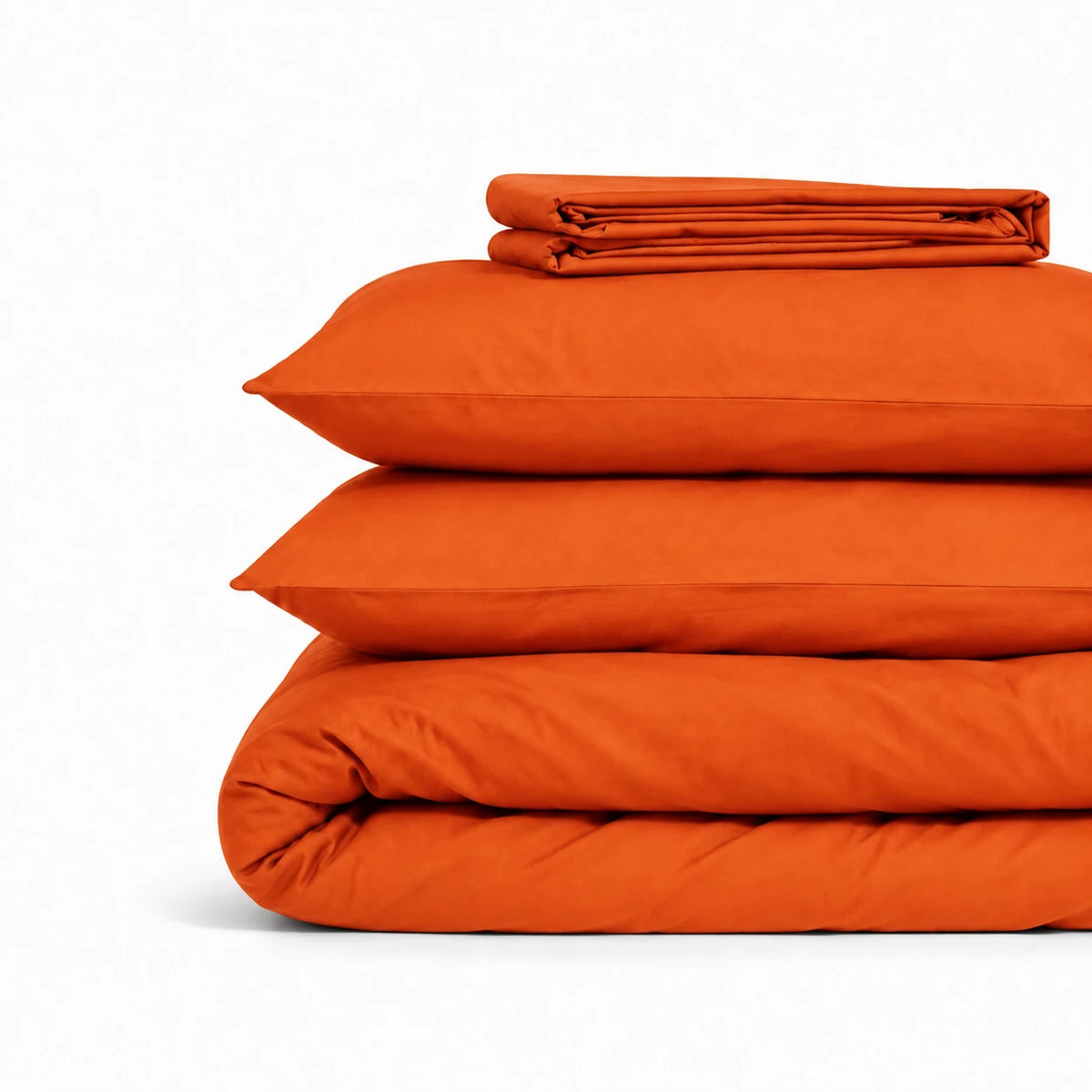 Parure de lit en coton terracotta pliée : housse de couette, taies et drap housse