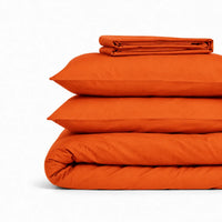 Parure de lit en coton terracotta pliée : housse de couette, taies et drap housse