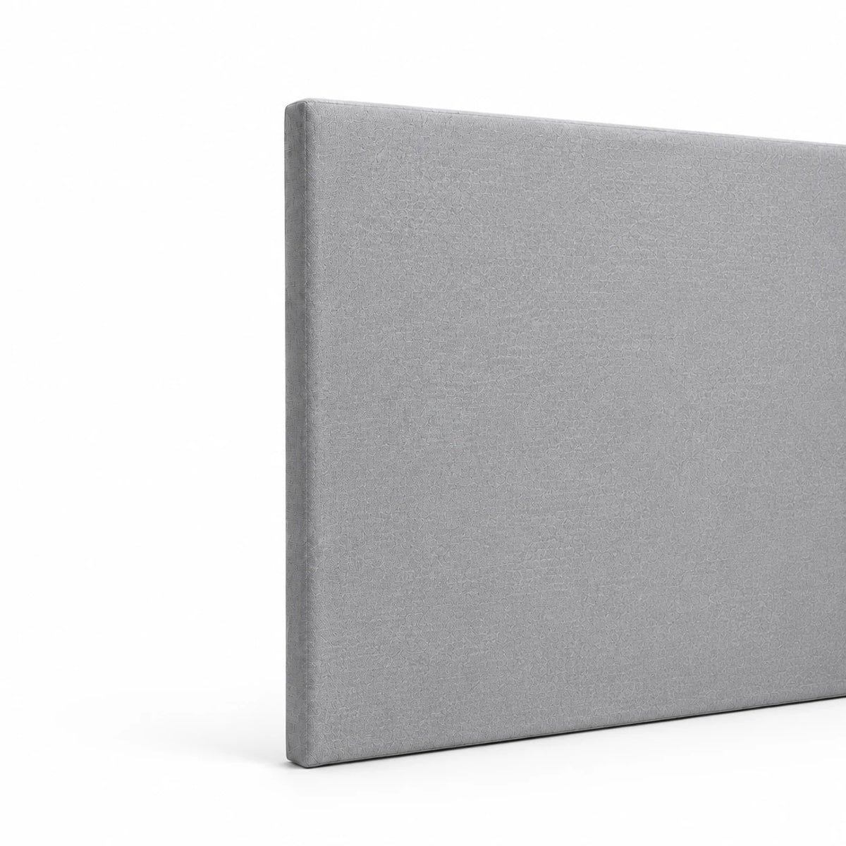 Tête de lit en tissu gris chiné, vue de côté